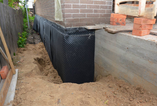 SJ Waterproofing Pros technician performing targeted Waterproofing assessment in Essington, PA